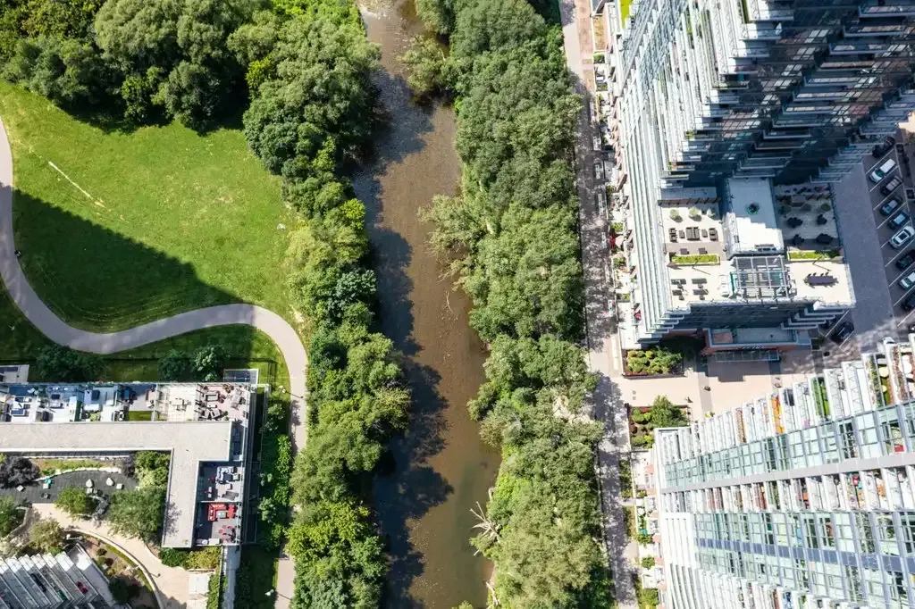 High-angle shot of the lush Mimico Creek greenery near 10 Park Lawn Rd, Unit 3402.