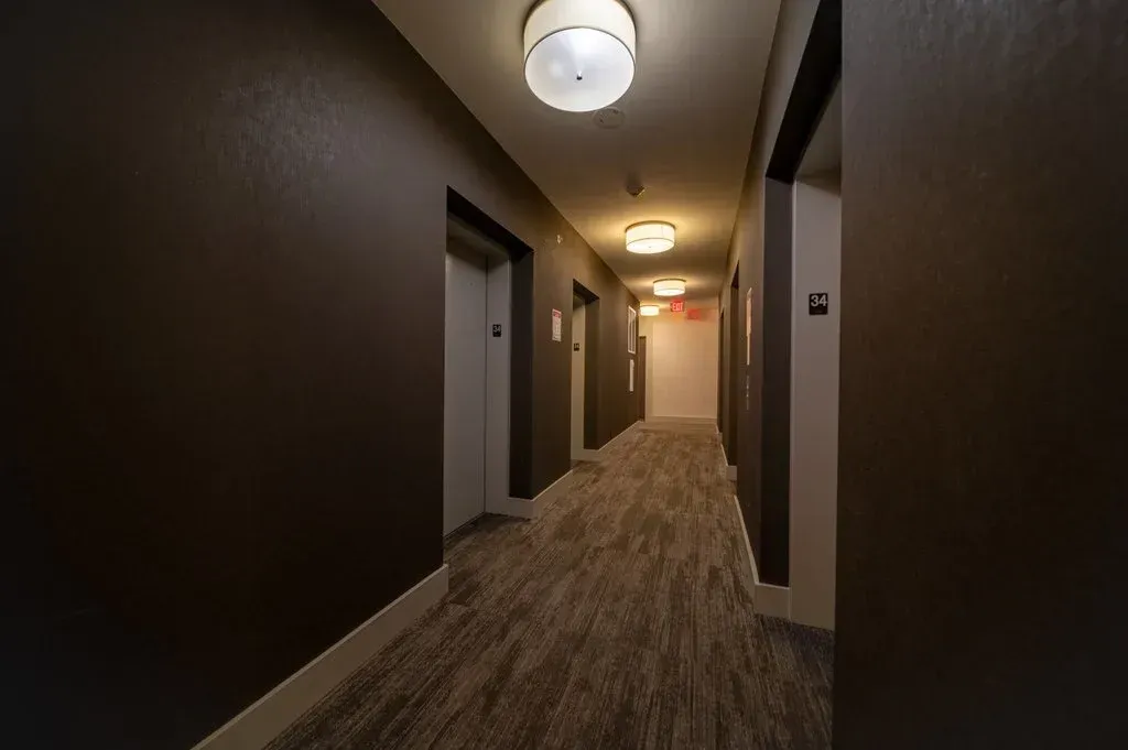 Modern, well-lit common corridor at Westlake Encore, 10 Park Lawn Rd, Unit 3402.