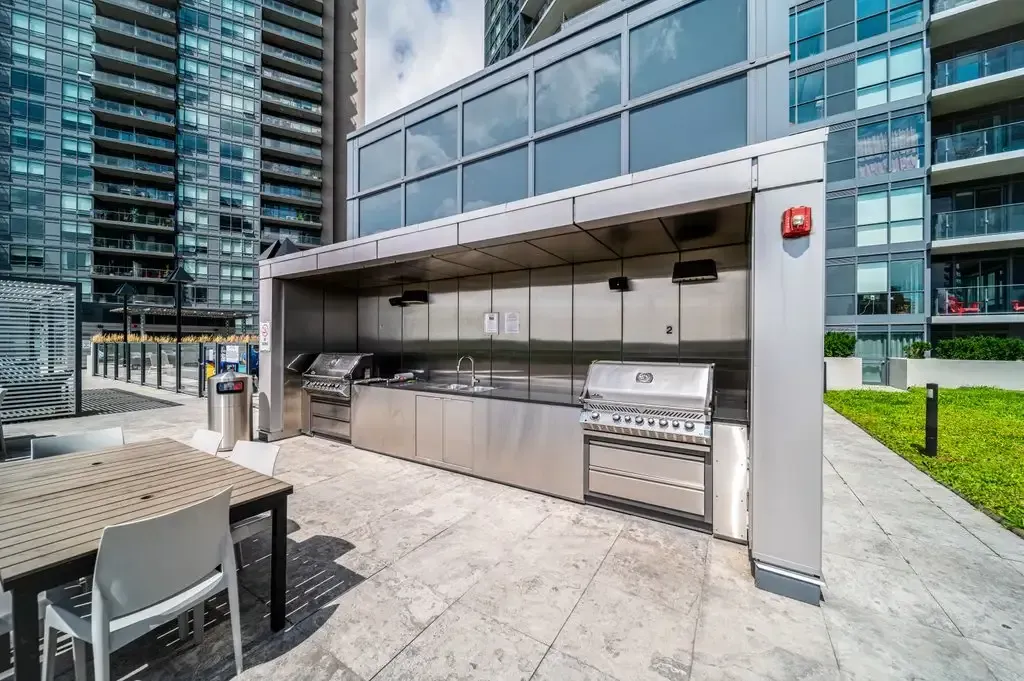Communal rooftop grilling station at 10 Park Lawn Rd, Unit 3402 with high-end equipment.