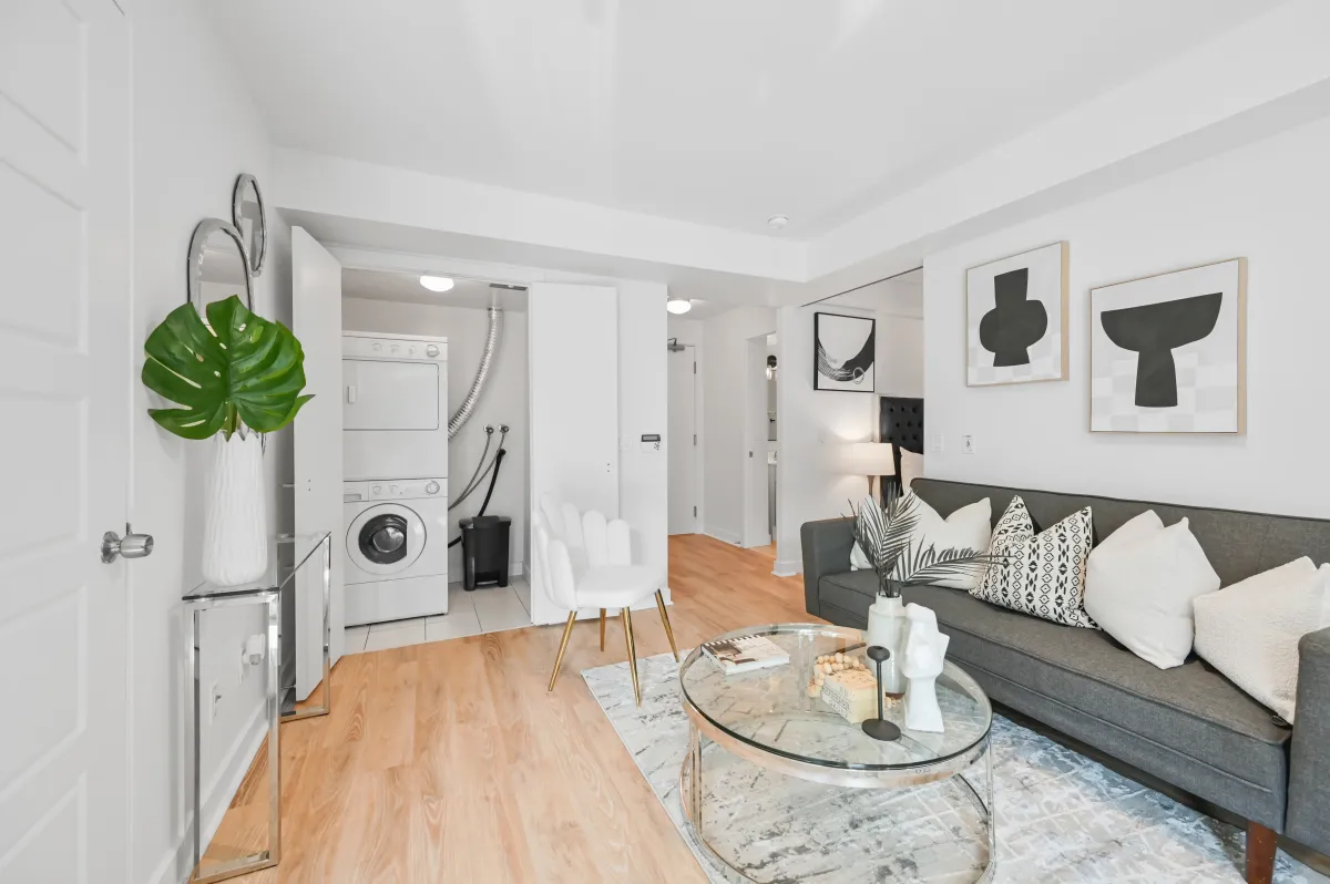 View from the living area toward the entryway of the 2-bedroom split layout at 100 Western Battery Rd, Unit 1911.