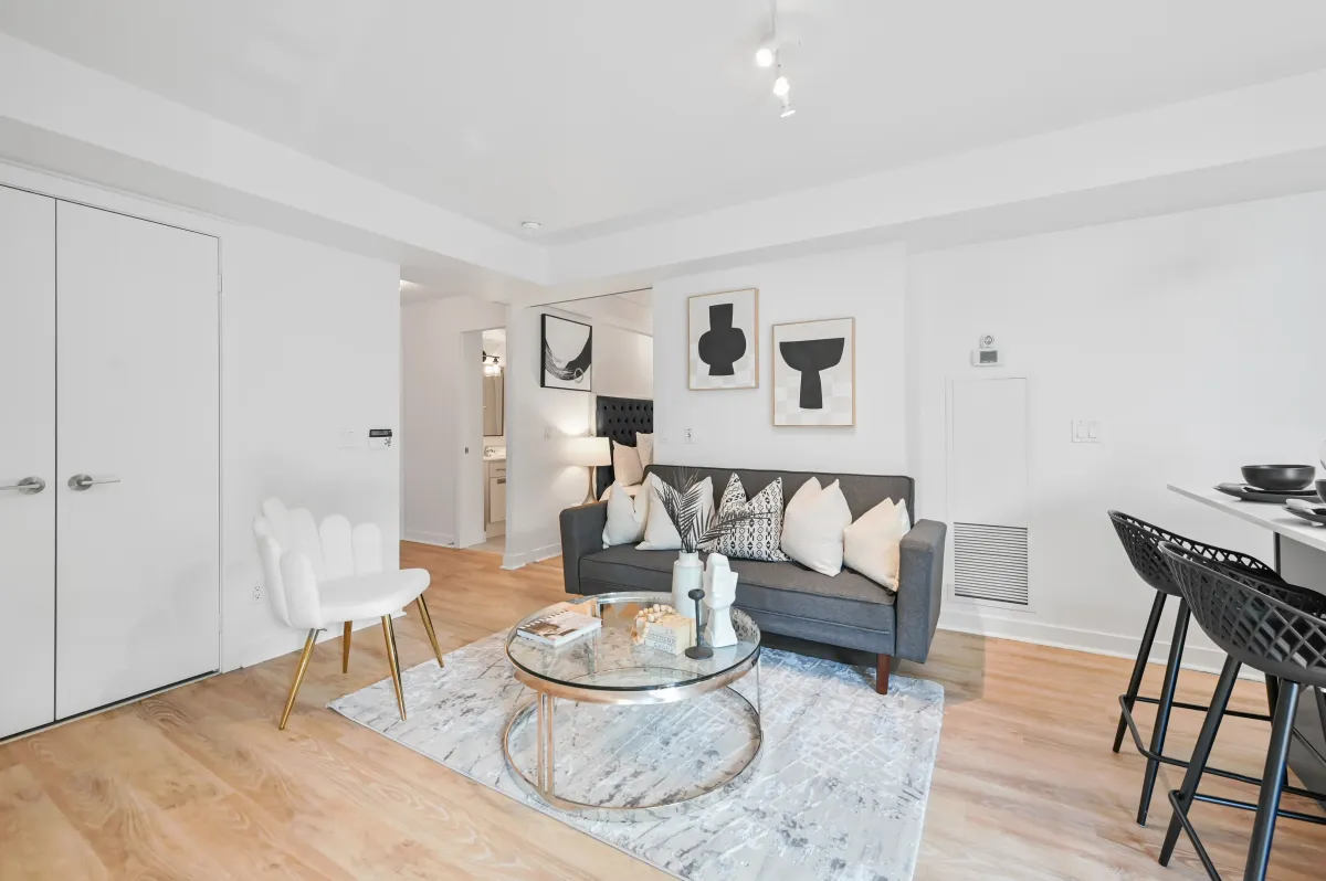 Stylish living room at 100 Western Battery Rd, Unit 1911 featuring floor-to-ceiling windows and smooth ceilings.