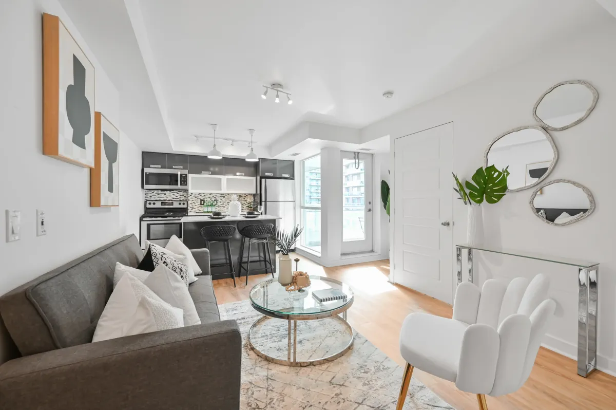 Chef’s kitchen at 100 Western Battery Rd, Unit 1911 with dark cabinetry and a functional kitchen island.