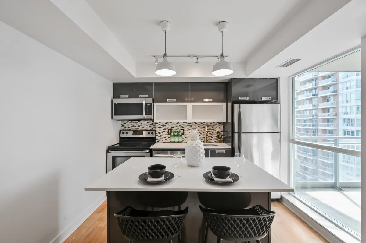 Wide-angle shot of the modern kitchen at 100 Western Battery Rd, Unit 1911 highlighting the split-bedroom flow.