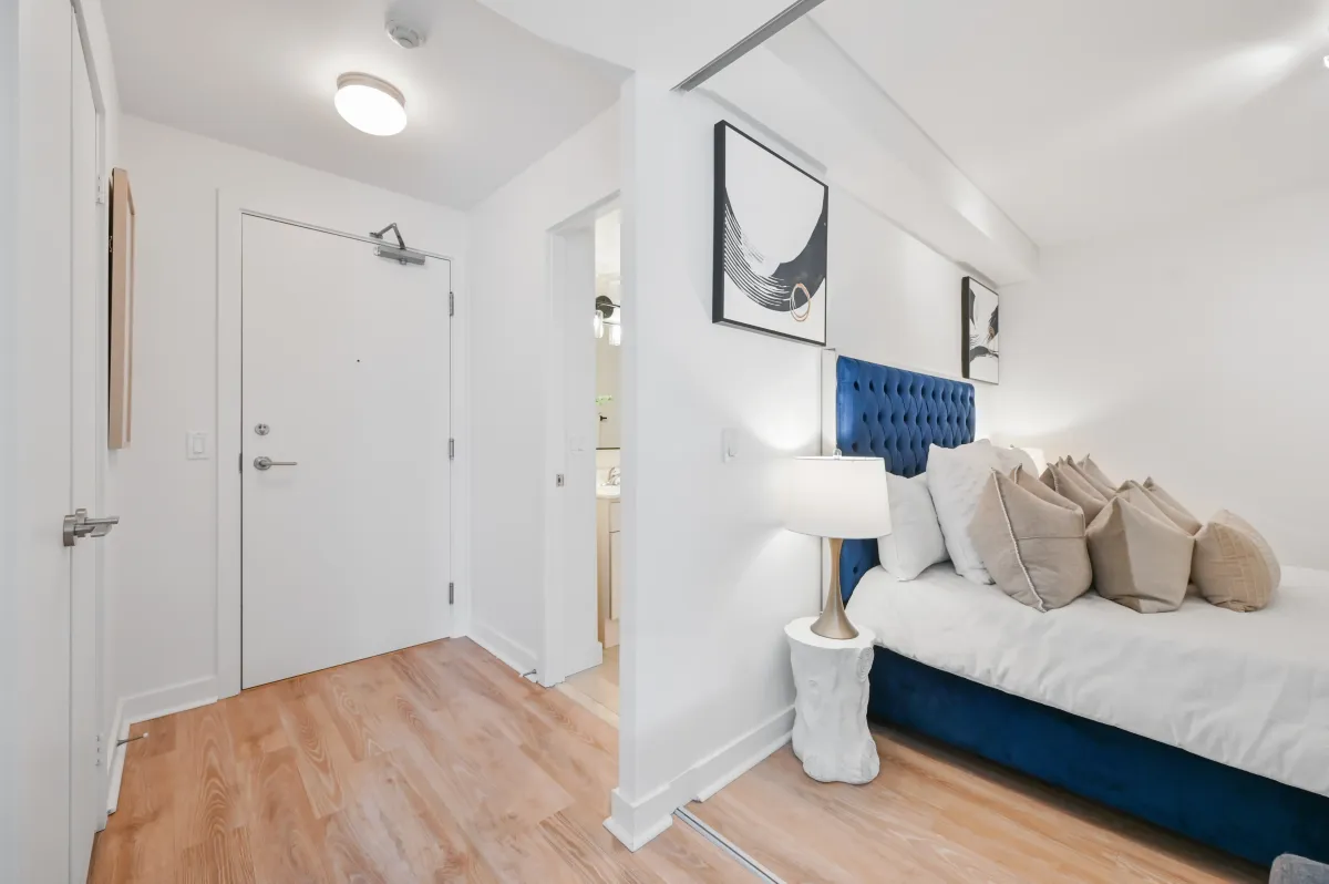View leading into the comfortable bedroom suite at 100 Western Battery Rd, Unit 1911.