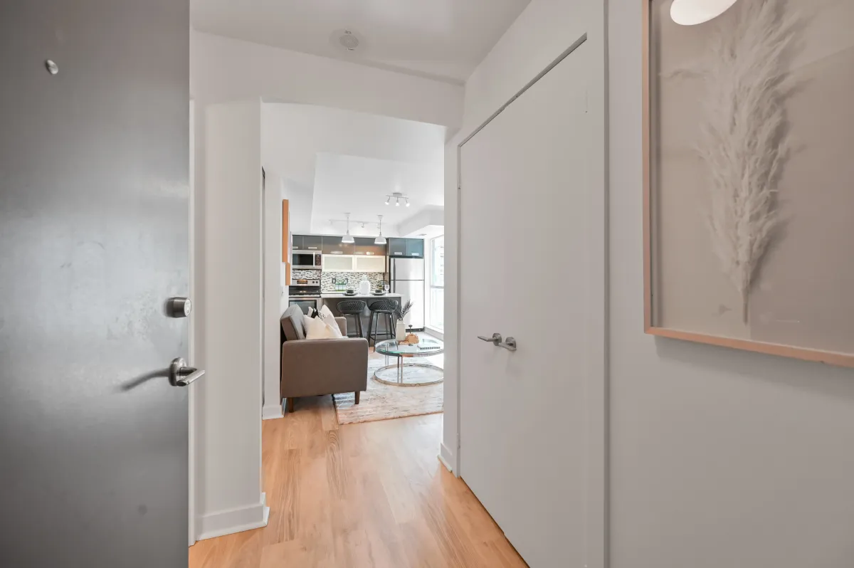 Clean and modern entryway of 100 Western Battery Rd, Unit 1911 leading into the sun-drenched living space.