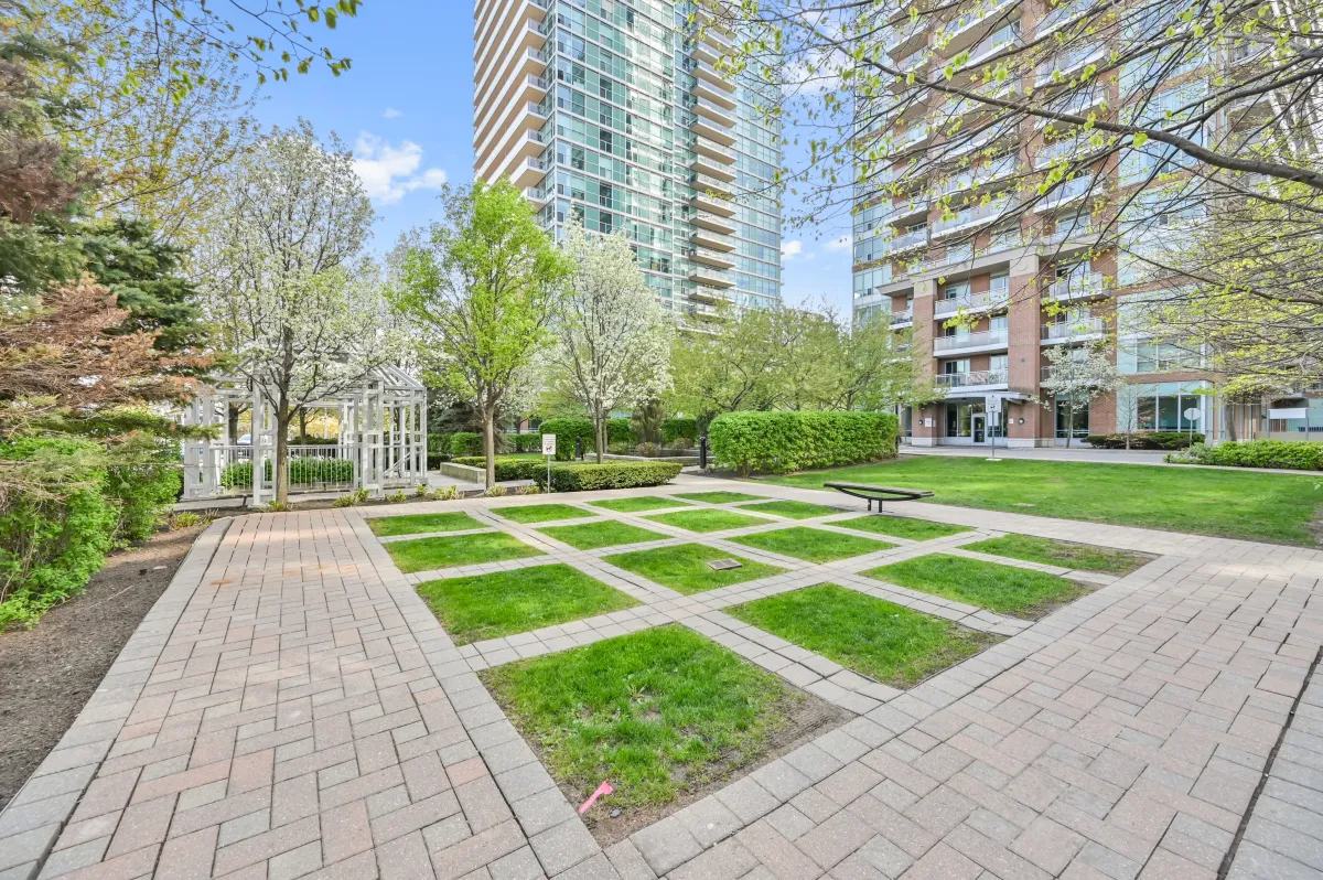 Lush green park and seating areas just steps away from 100 Western Battery Rd, Unit 1911.