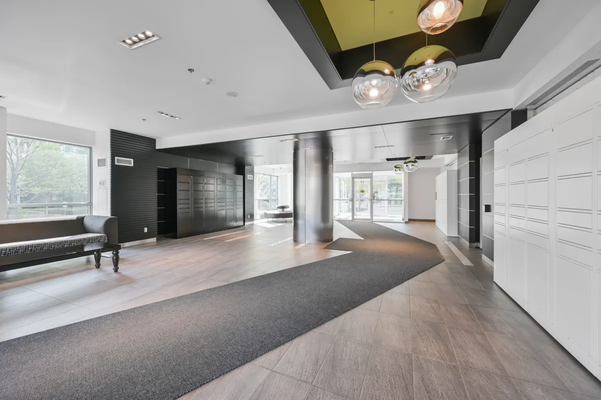 Sophisticated resident lounge and mailroom area at 100 Western Battery Rd, Unit 1911.