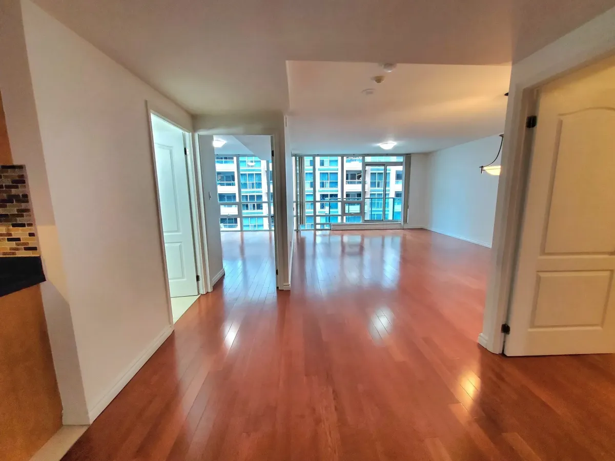 Perspective shot of the nearly 900 sq. ft. interior at 263 Wellington St W, Unit 701 showing the seamless flow between rooms.