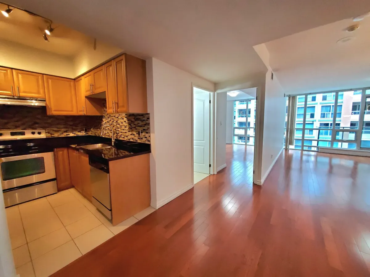 Secondary angle of the chef's kitchen at 263 Wellington St W, Unit 701 highlighting the open-concept design for entertaining.