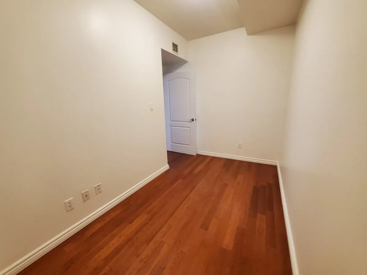 Large, versatile den at 263 Wellington St W, Unit 701, ideal as a professional home office or guest bedroom.