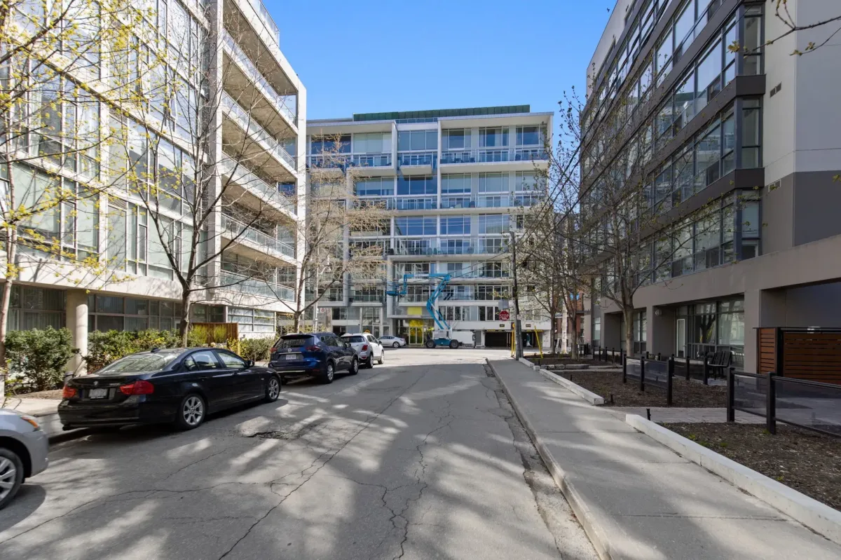 Street view of the boutique mid-rise architecture at 75 Portland St #807, highlighting the vibrant King West neighborhood.