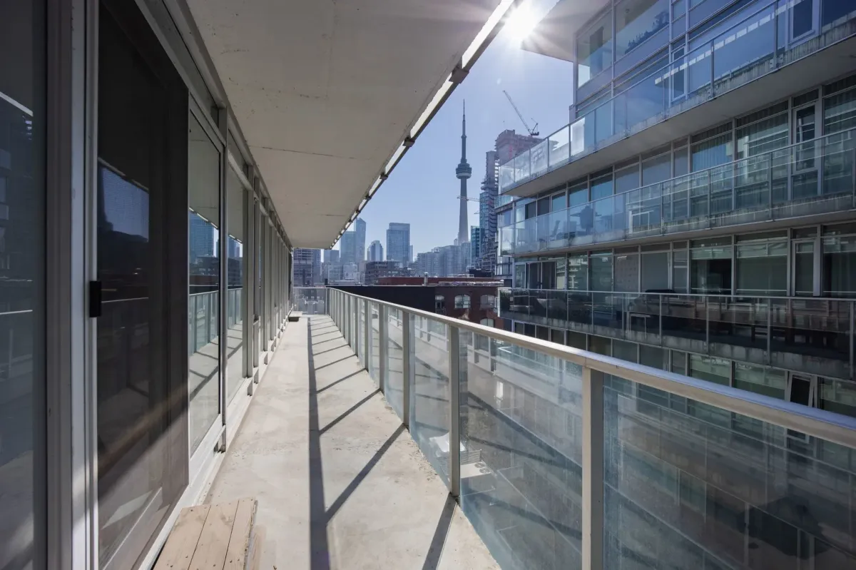 Expansive wrap-around balcony at 75 Portland St #807, featuring a gas hook-up and stunning views of the Fashion District.