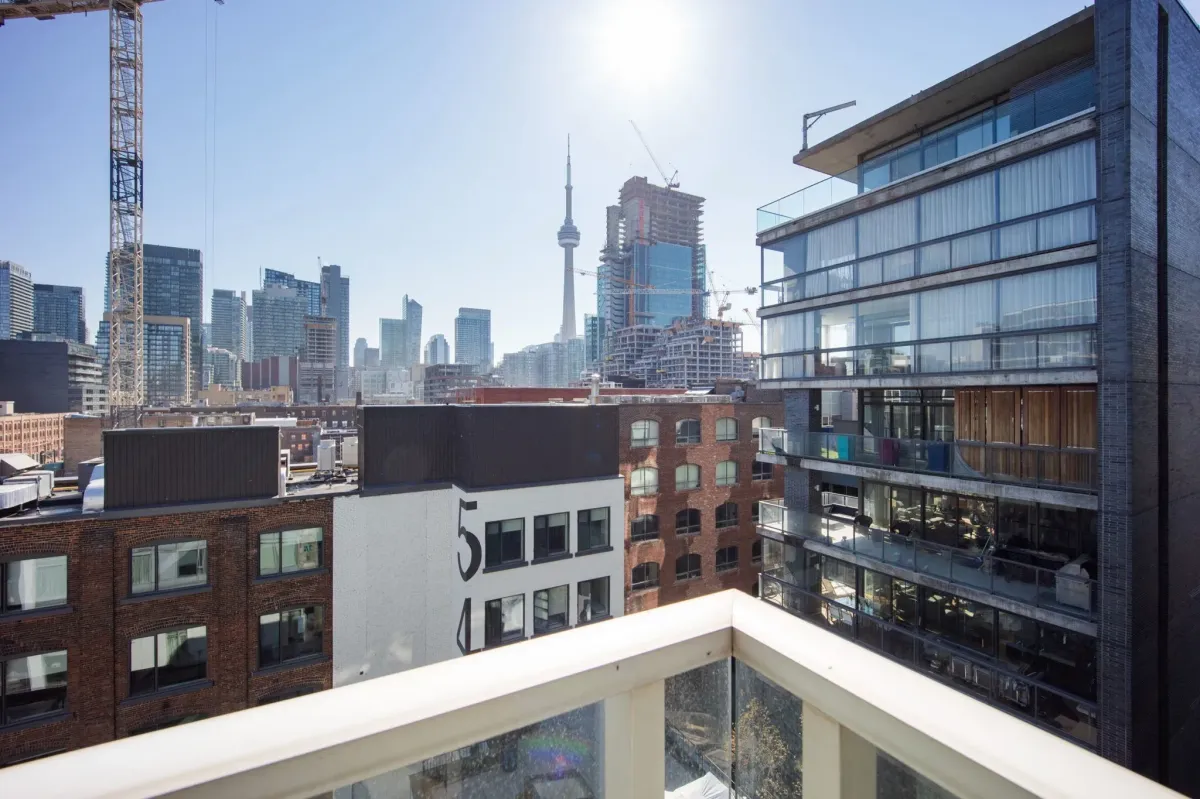 Breathtaking view of the Toronto Downtown skyline and CN Tower from the massive 236 sq. ft. terrace at 75 Portland St #807.