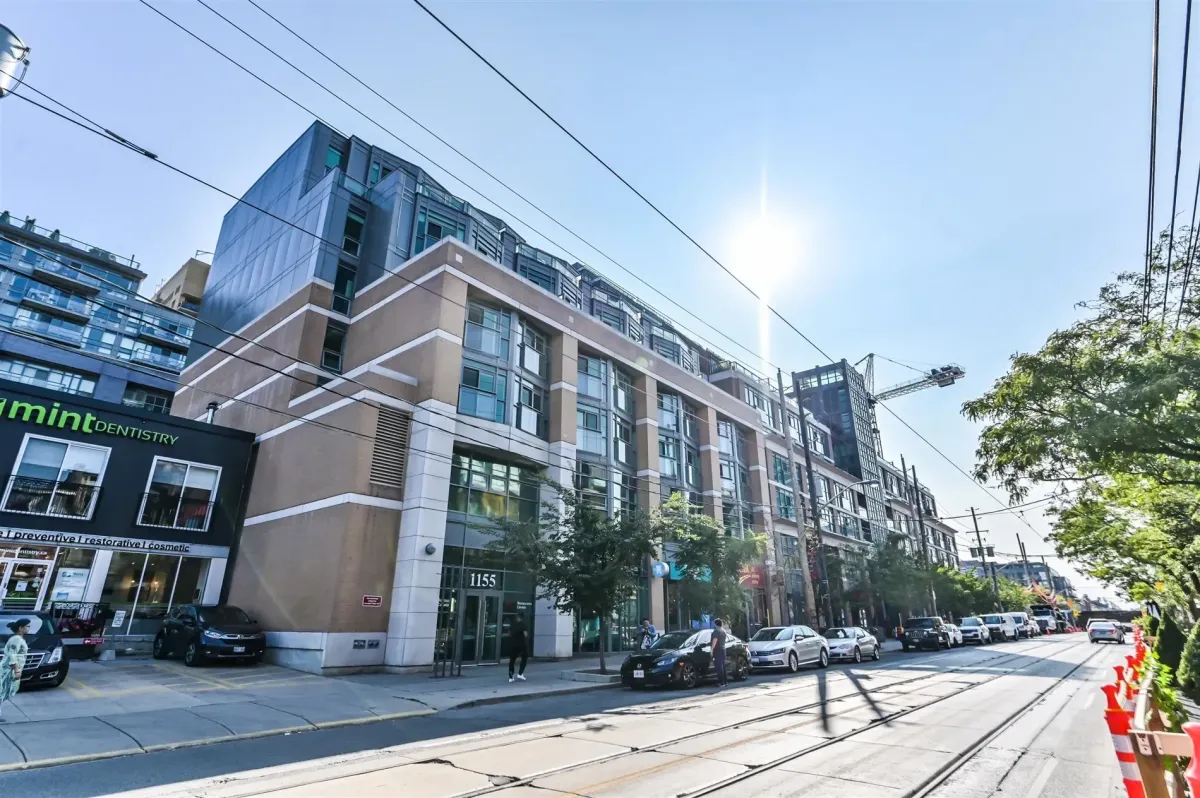 Street level view of 1169 Queen St W, demonstrating its position in the cultural heart of Queen West, Toronto.