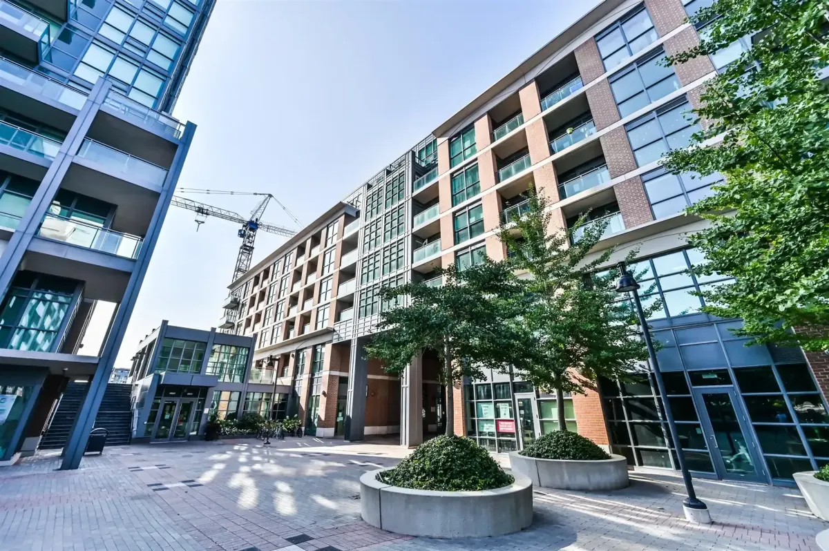Architectural perspective of the exterior and common areas at 1169 Queen St W, featuring modern residential design.