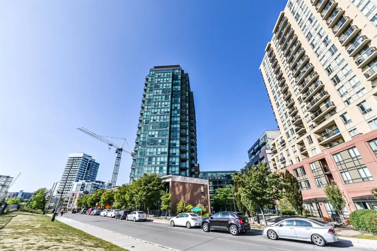 Open-concept living room at 1169 Queen St W, Unit N502, highlighting the bright space and engineered hardwood floors.