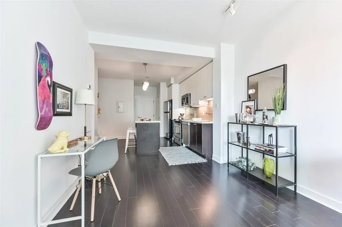 Close-up of the Caesarstone countertops and custom cabinetry in the kitchen at 1169 Queen St W, Unit N502.