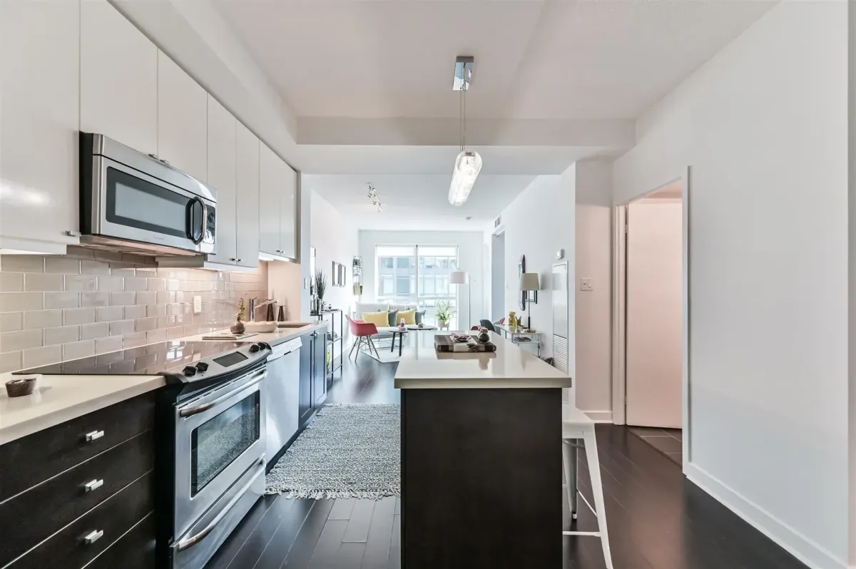 Versatile den in Unit N502, 1169 Queen St W, set up as a dedicated home office for the remote professional.