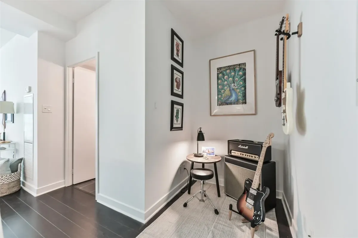 Panoramic view of the primary bedroom at 1169 Queen St W, Unit N502, showing its spacious loft-like feel.