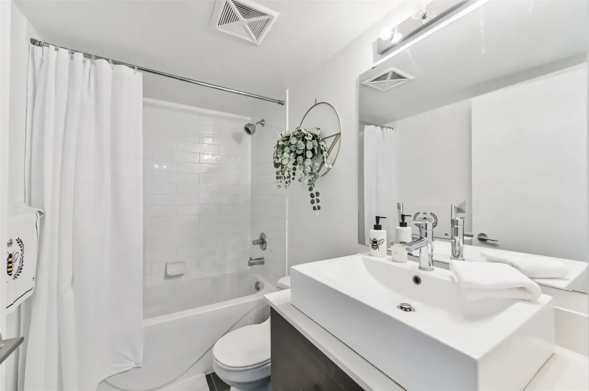 Rooftop deck lounge area at 1169 Queen St W, Unit N502, offering breathtaking panoramic Toronto skyline views.