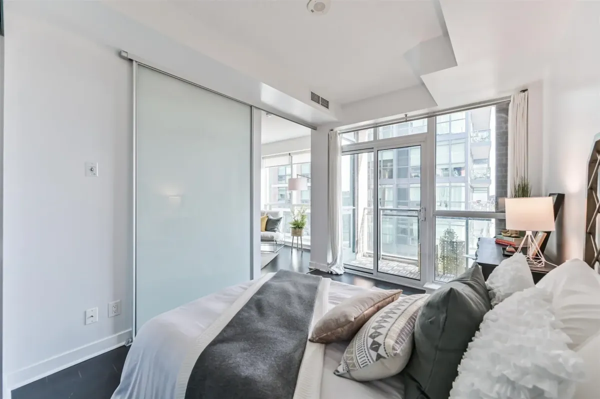 In-suite stacked washer and dryer closet at 1169 Queen St W, Unit N502, for convenient urban living.
