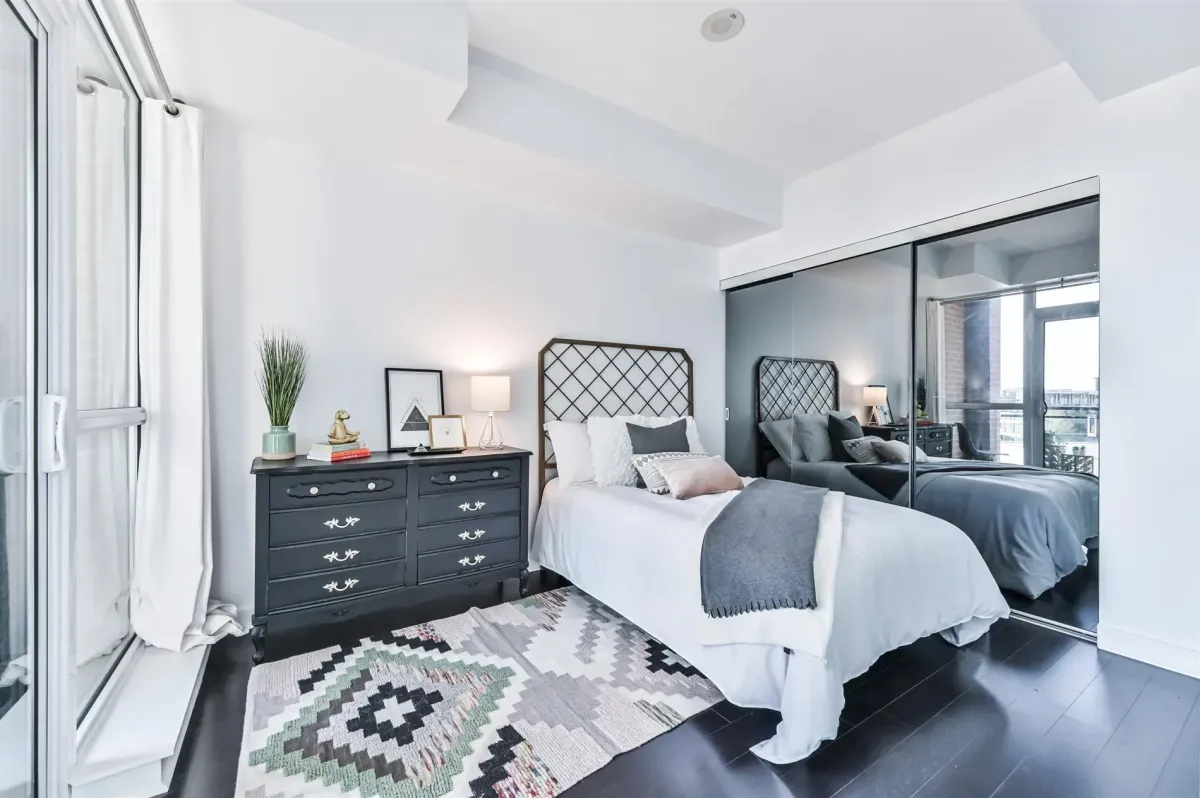 Deep soaking tub and shower in the primary bathroom at 1169 Queen St W, Unit N502.
