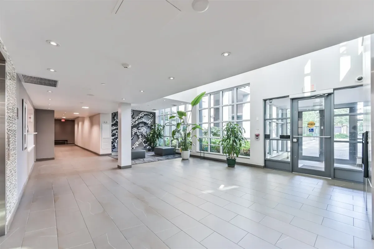 Ground level exterior amenity space and walkway at 1169 Queen St W, Unit N502.