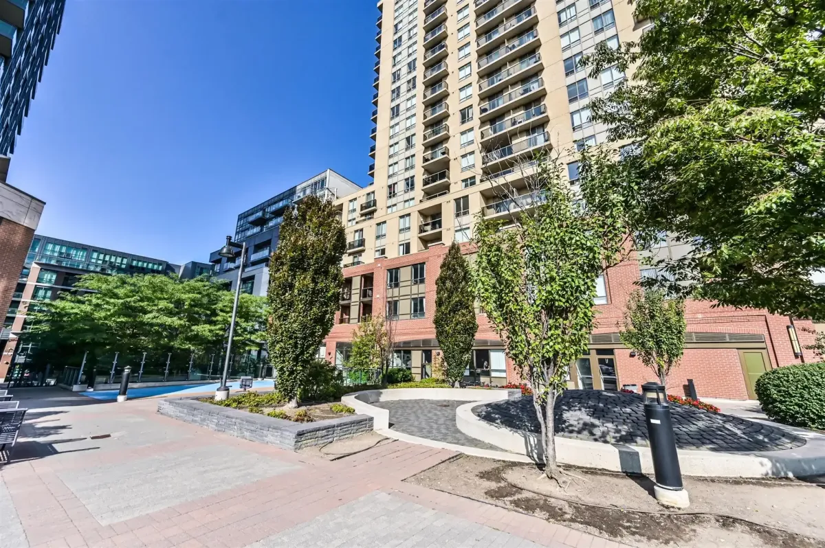 View from the ground level amenity courtyard at 1169 Queen St W, Unit N502, towards the historic neighborhood.
