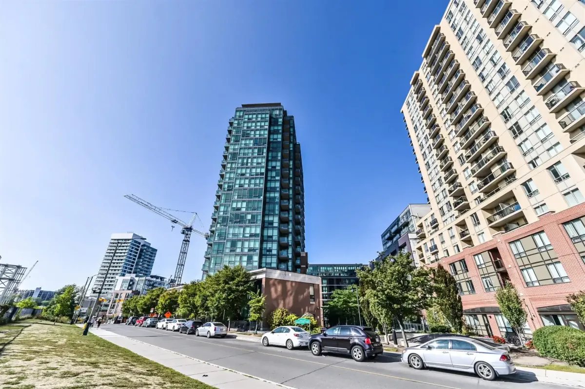 Wide exterior view of 1169 Queen St W, positioned along the iconic Queen West strip near Trinity Bellwoods Park.
