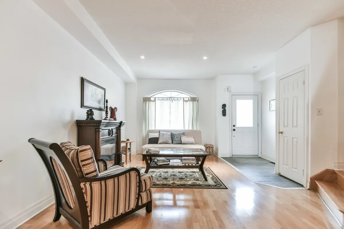 View of the airy living room at 9 Algarve Cres, featuring large windows and elegant interior design.