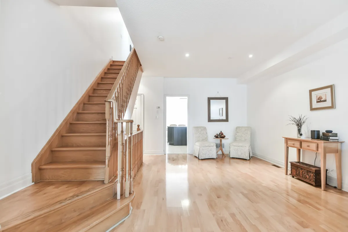 Wooden staircase and foyer at 9 Algarve Cres, showcasing the high-quality finishes and architectural detail.