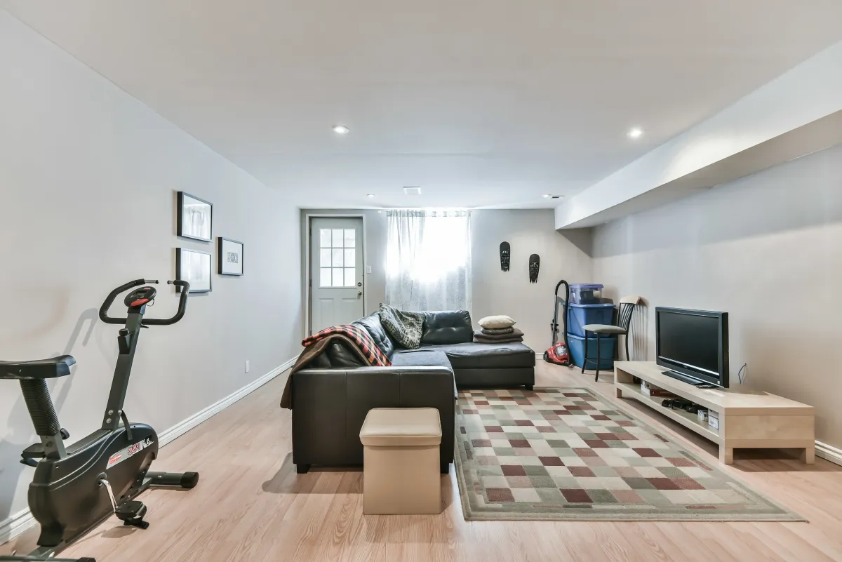 Spacious family room in the finished basement at 9 Algarve Cres, ideal for a gaming room or media lounge.