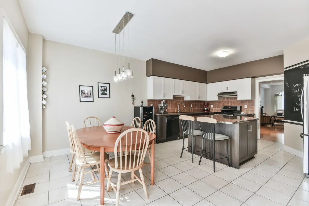 Bright eat-in kitchen at 9 Algarve Cres, showing the natural light from the adjacent dining area.