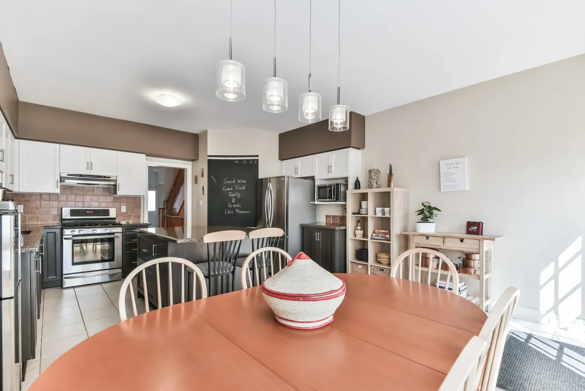 Detailed view of the kitchen island and dining table at 9 Algarve Cres, perfect for family gatherings.