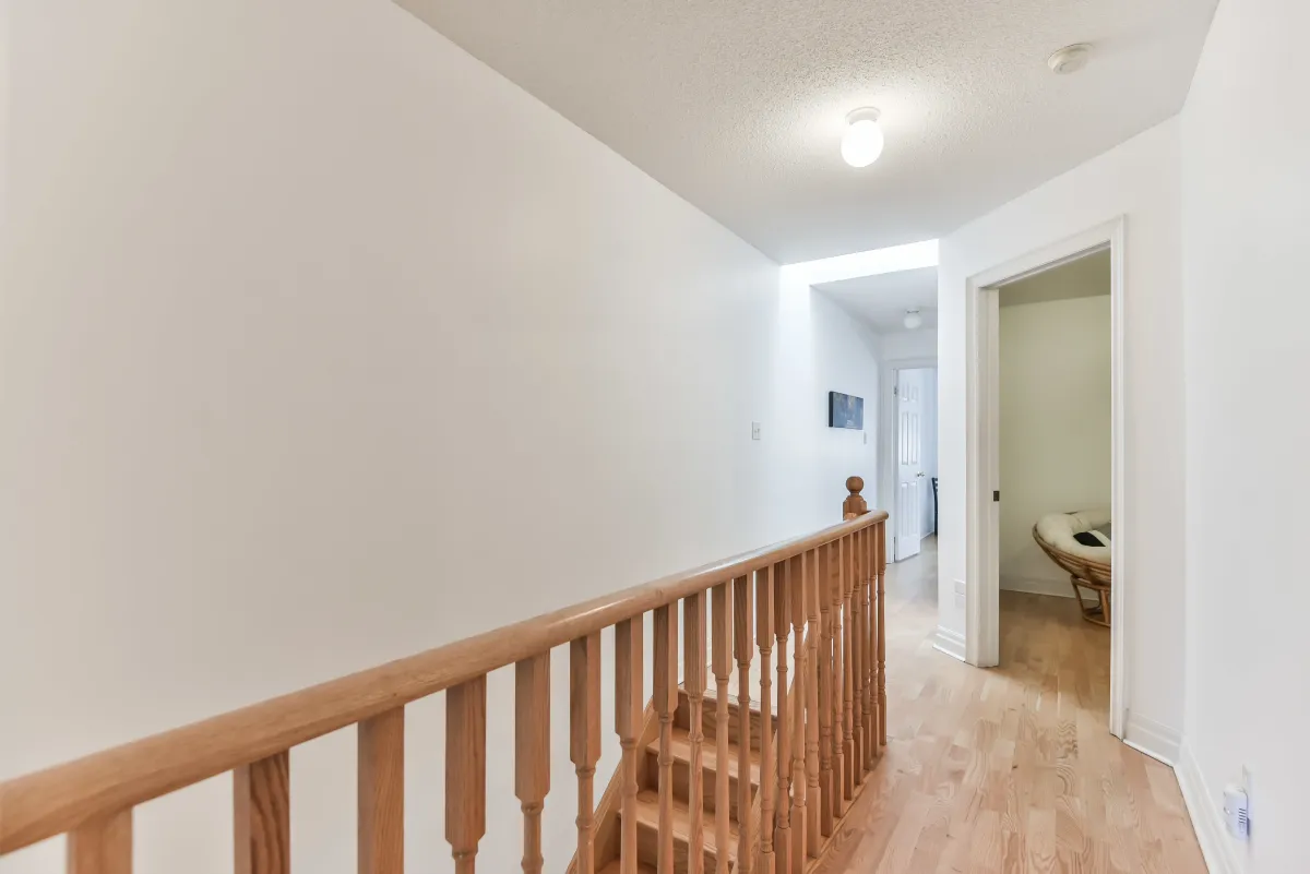 Bright upper hallway at 9 Algarve Cres, leading to three generously sized bedrooms.
