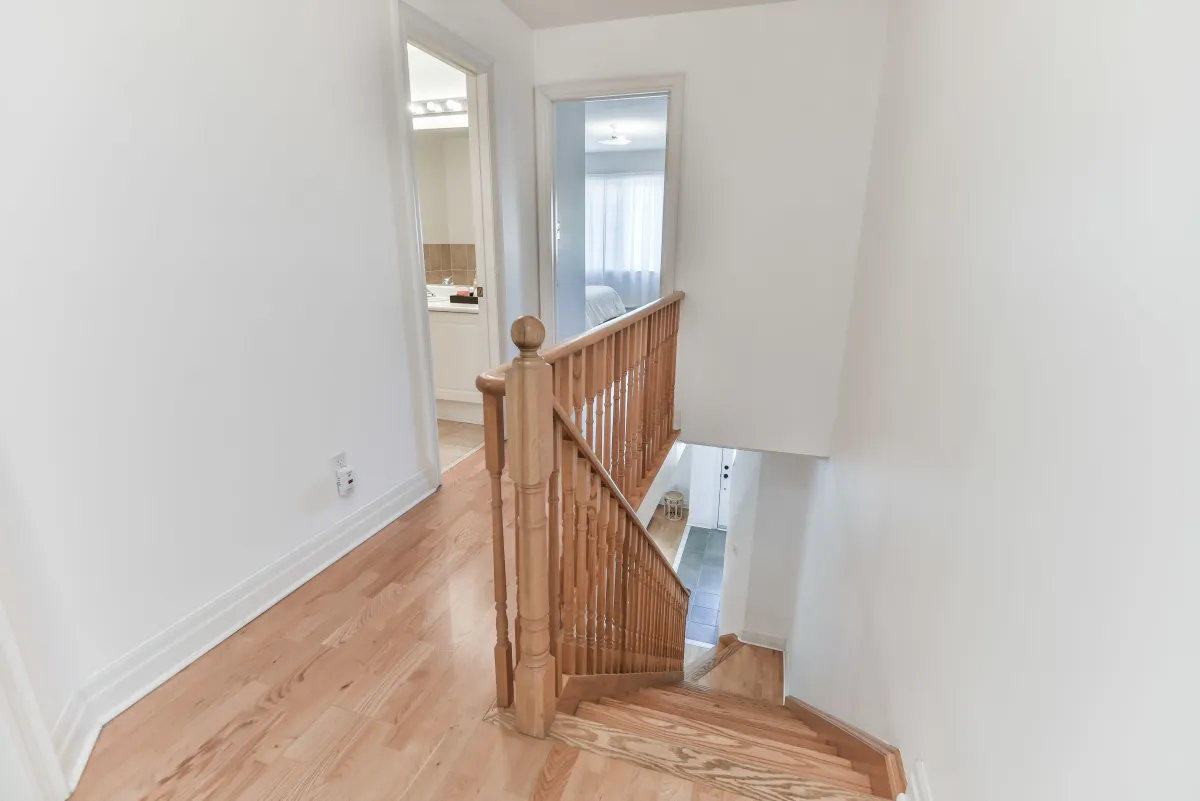 Upper level landing at 9 Algarve Cres, flooded with natural light from the skylight above.