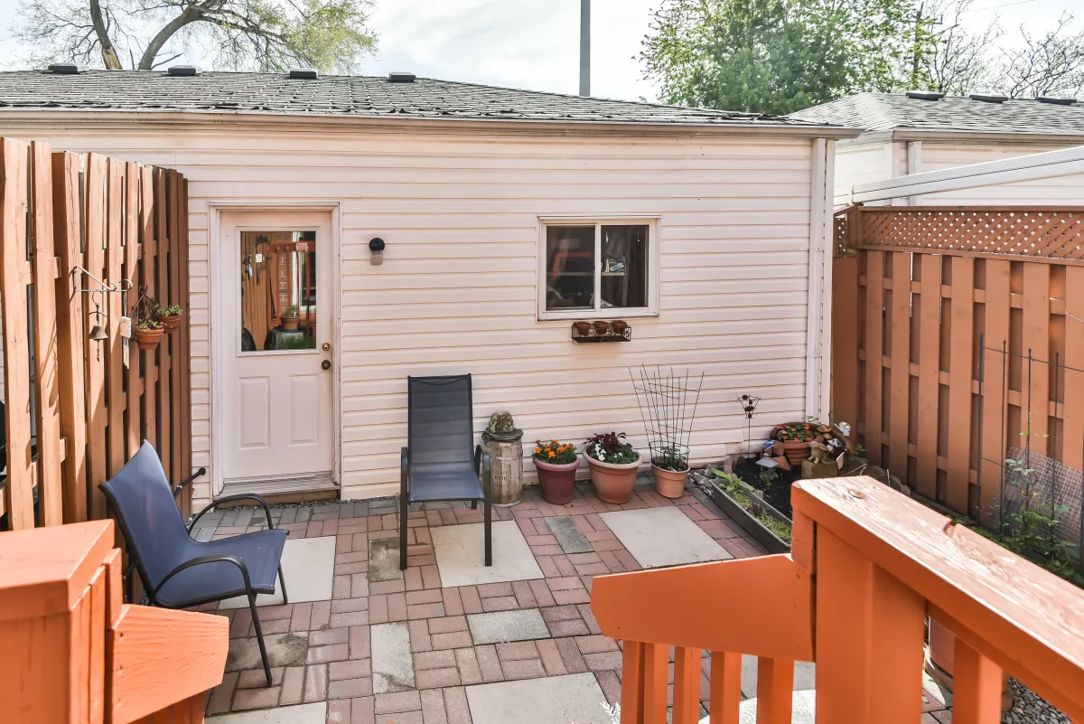 Private garden space and patio at 9 Algarve Cres, highlighting the fully fenced-in backyard.