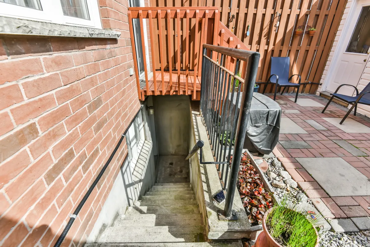 Basement walk-out access and stairs at 9 Algarve Cres, leading to the private rear garden.