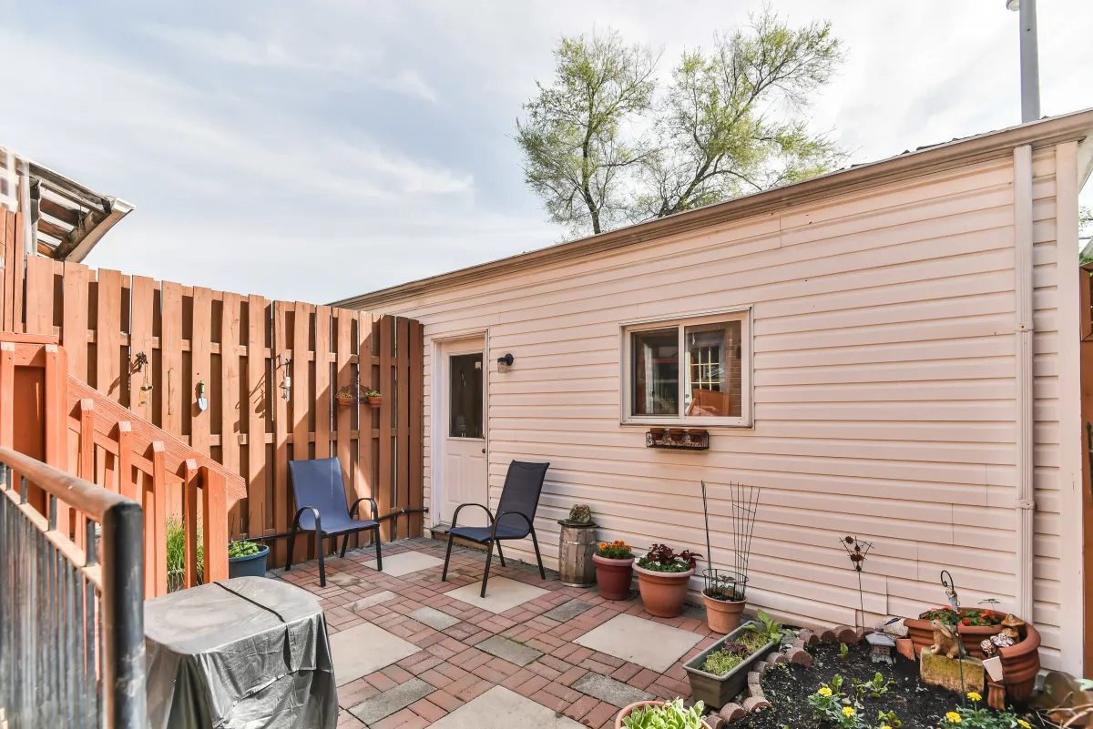 Lush private backyard sanctuary at 9 Algarve Cres, perfect for summer hosting and outdoor dining.