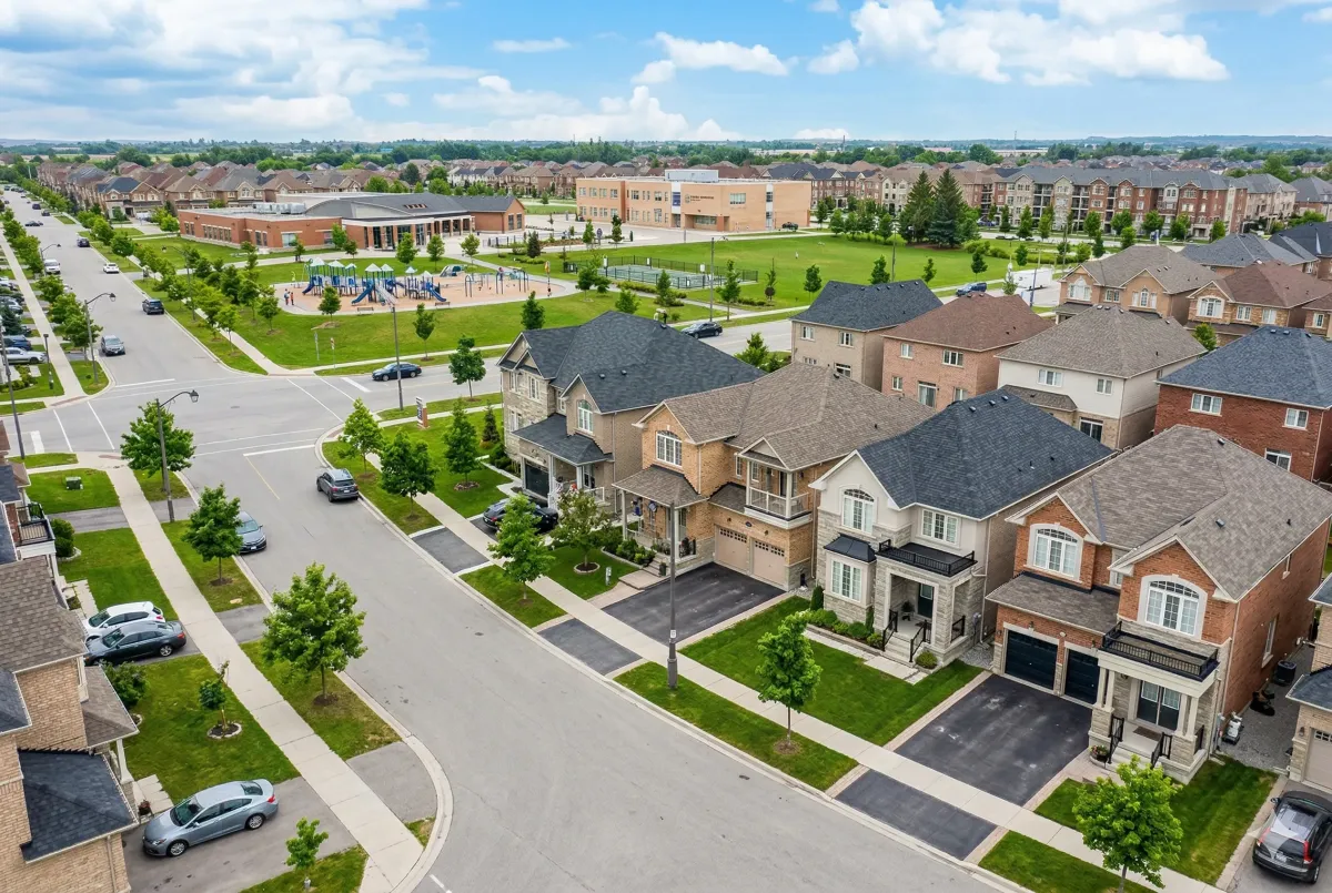 Executive detached two-storey home in Sandringham-Wellington, Brampton, featuring a contemporary brick and stone facade with a double-car garage.