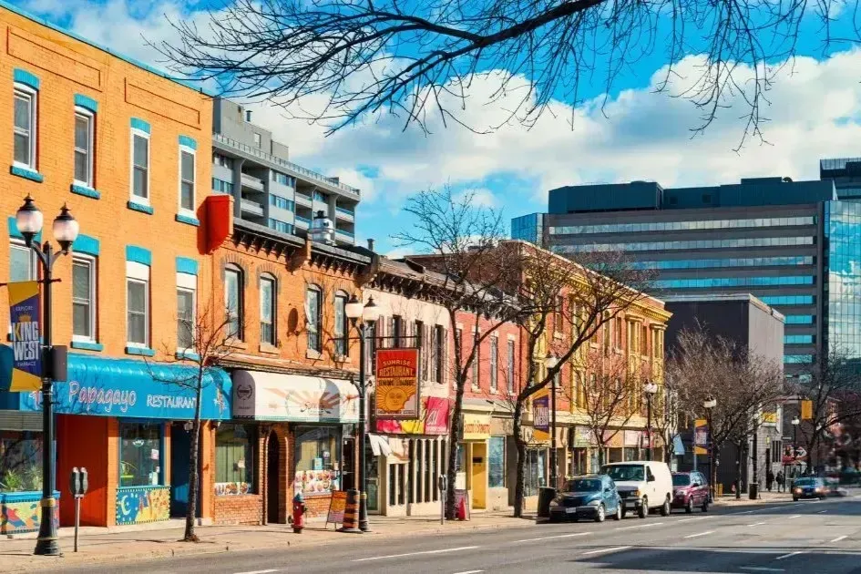 A busy street view of the downtown Hamilton business district showing local shops and commercial buildings.