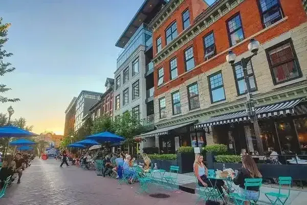A vibrant patio dining scene on a popular Hamilton street known for its restaurants and nightlife.