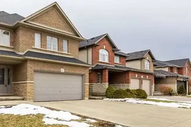 Suburban residential subdivision with modern detached homes in West Hamilton.