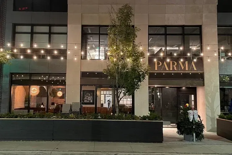 Storefront sign for Conversate Steak and Seafood restaurant in Hamilton.