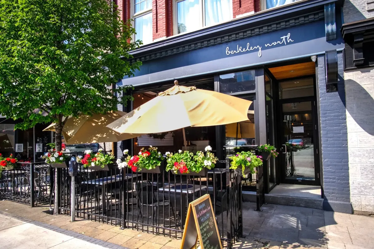 Outdoor patio and storefront of Berkeley North restaurant in downtown Hamilton.