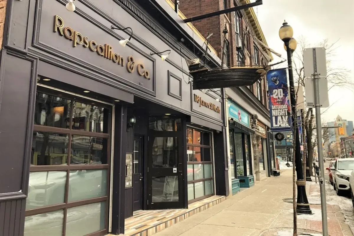 The dark modern storefront of Rapscallion Rogue Eatery in Hamilton.