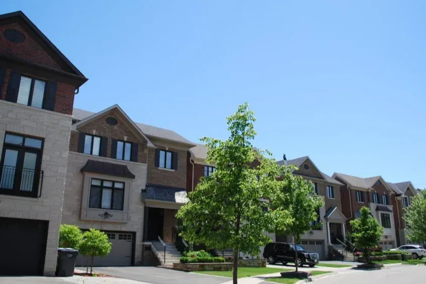 Modern multi-level townhouses and greenery in the Applewood community.