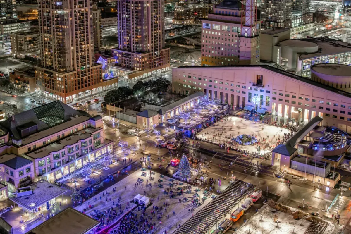 Aerial night view of Celebration Square and the high-rise buildings in Mississauga City Centre.