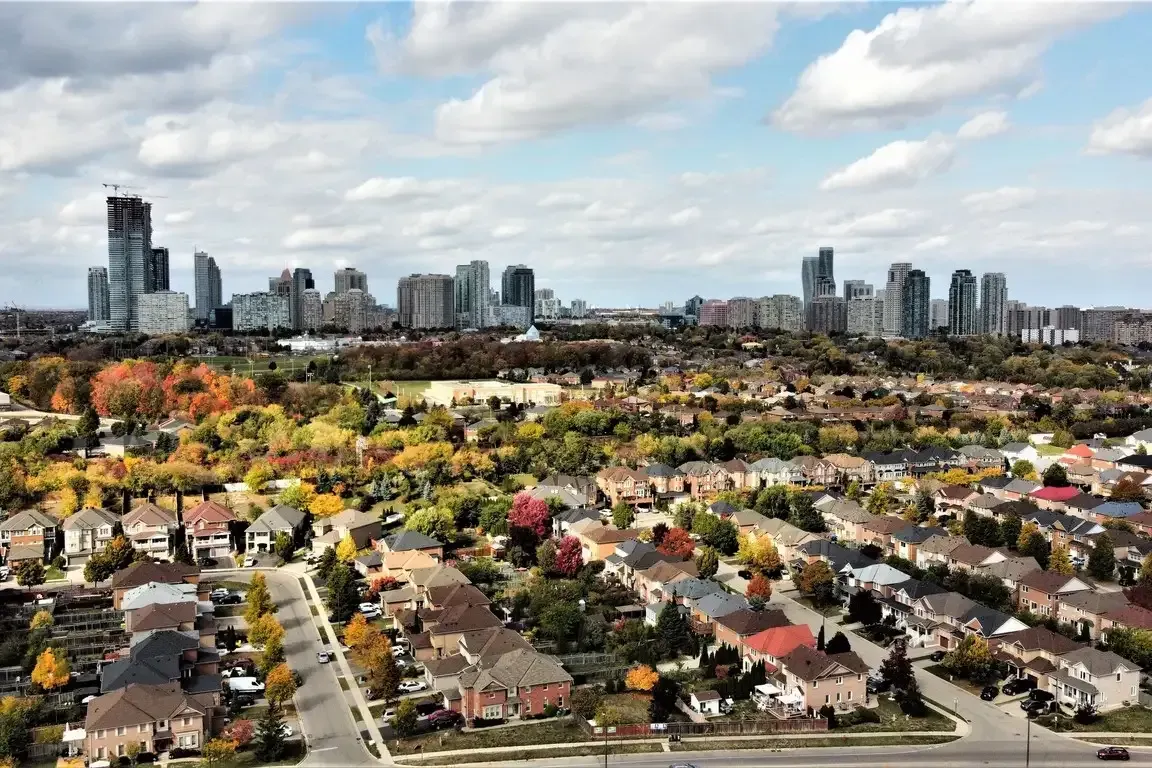 Elevated view of the residential subdivisions in Churchill Meadows with the city skyline in the distance.