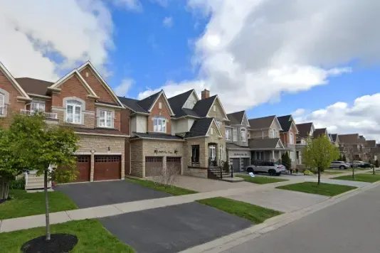 A row of modern detached suburban homes in the Erin Mills neighborhood.